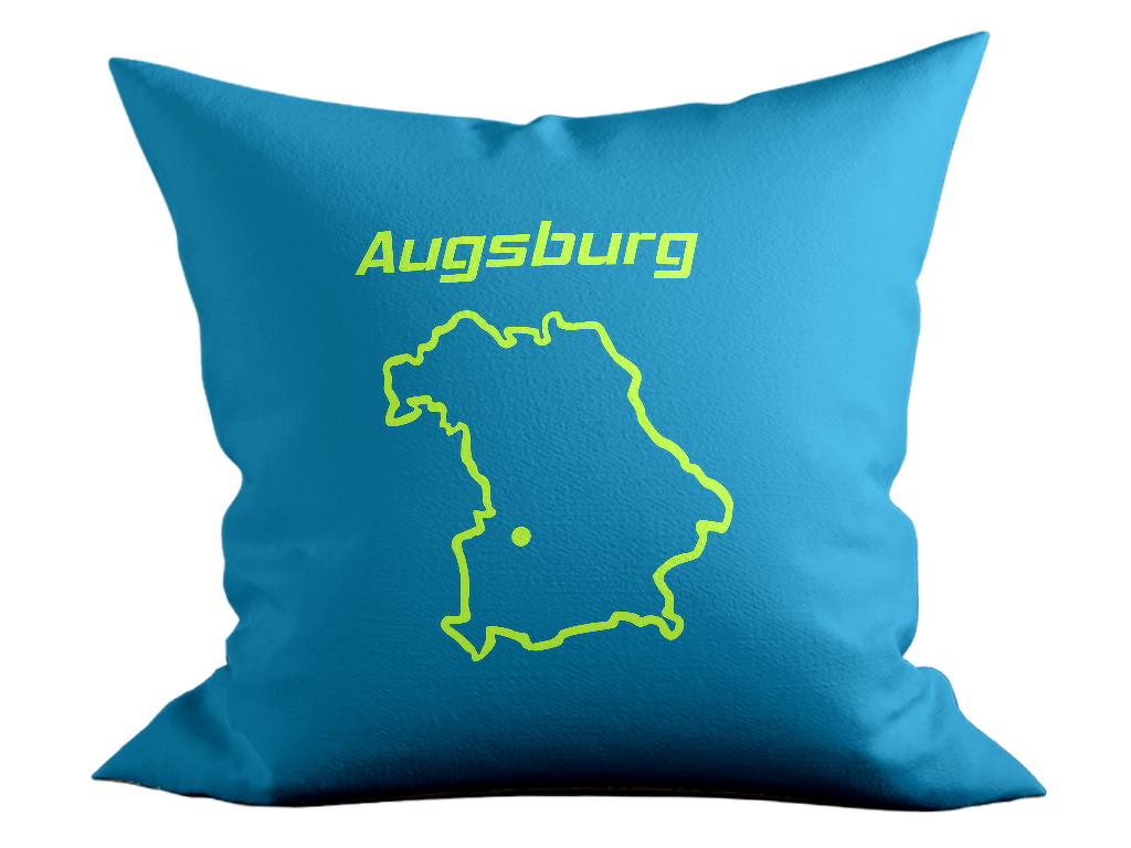 Türkisfarbenes Kissen mit neongrüner Plottgrafik: Schriftzug 'Augsburg', stilisierter Bayern-Umriss und Punktmarkierung