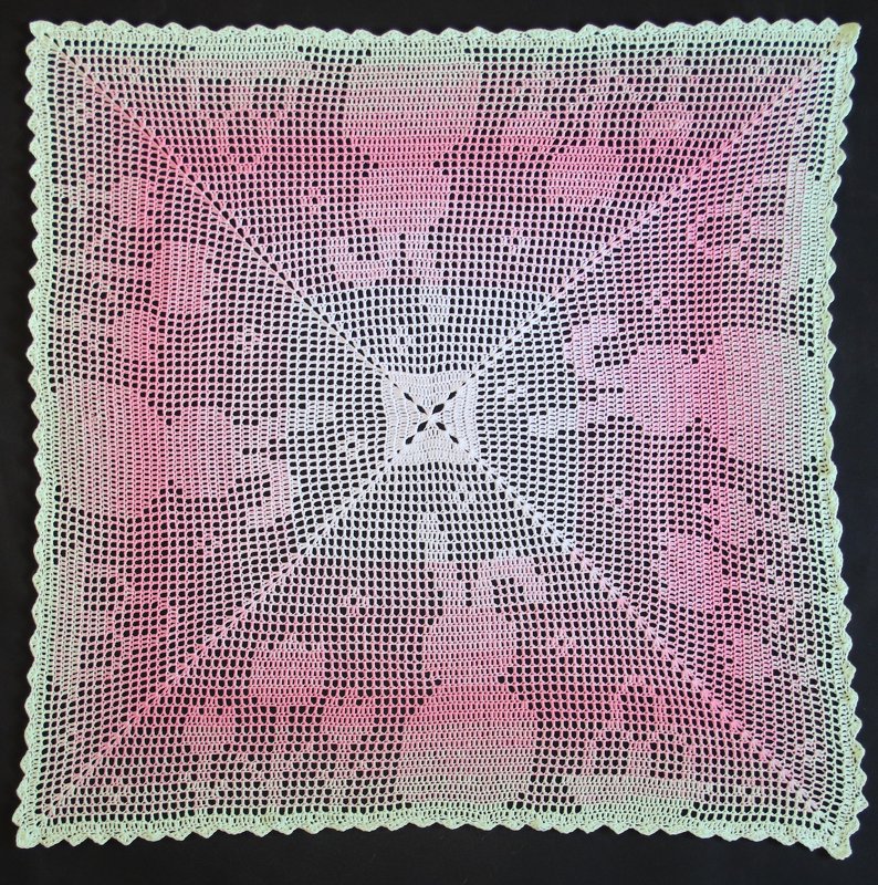 square fillet crochet doily with floral motifs, central square and scalloped border