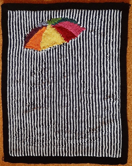 Schattenstrickbild mit buntem Regenschirm 2 Nur für Farbwechsel-Geübte.