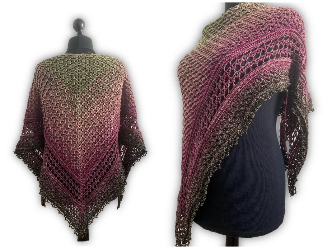 Gradient ombré crocheted triangle shawl with lace panels and scalloped edge displayed on a mannequin