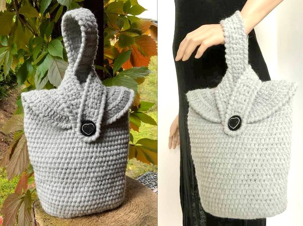 Hellgraue gehäkelte Henkeltasche mit kurzem Griff und schwarzem Herzknopf, freistehend und am Arm getragen
