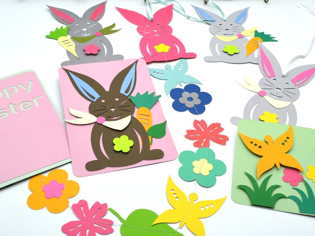 Pastellfarbene, mehrschichtige Papierhasen, Blumen und Schmetterlinge als Anhänger, Karten und Girlande
