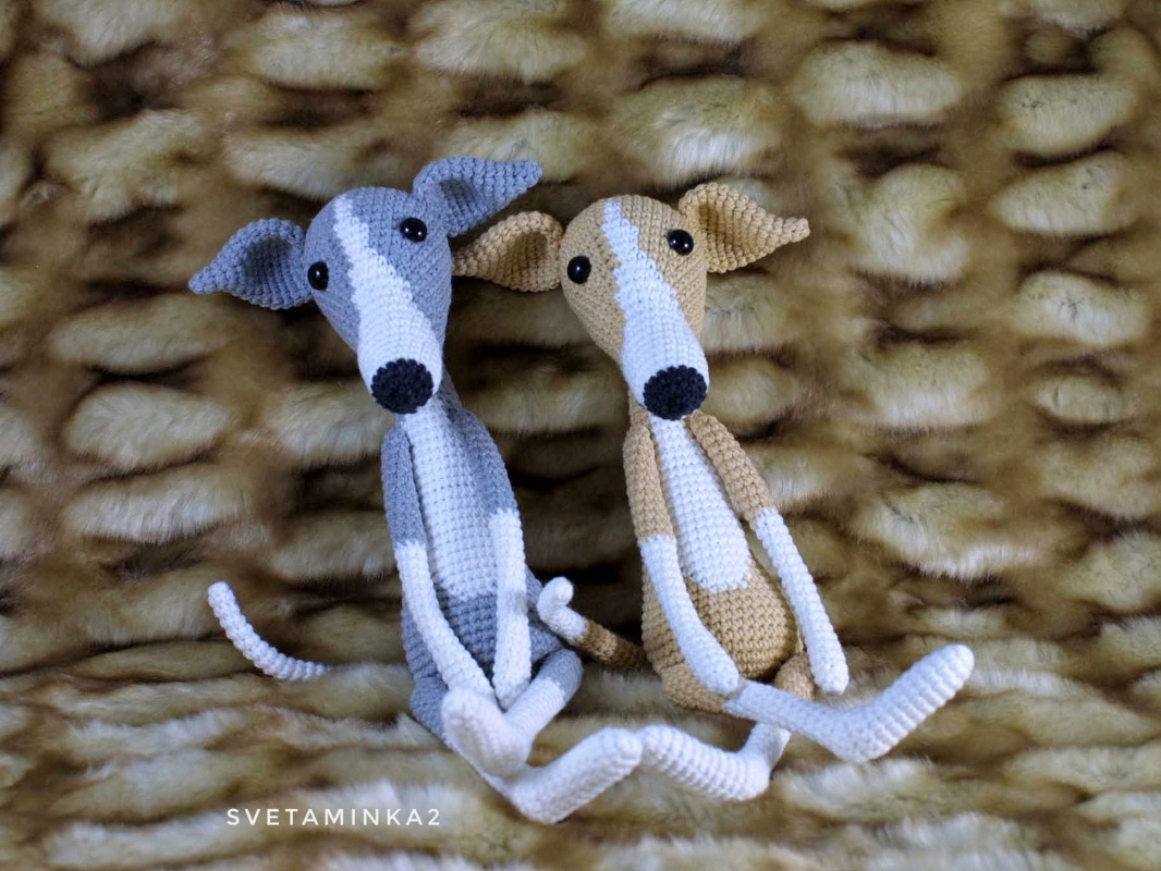Image of two crocheted dogs highlighting long limbs, tapered snouts, folded ears, and stitch texture
