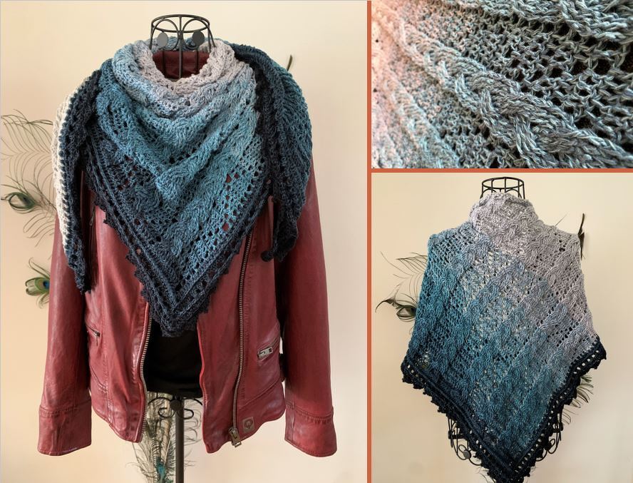Ombre crocheted triangle shawl in grey to deep blue with textured cable and openwork lace, displayed on a mannequin.