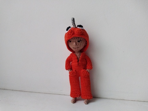 Doll with chainsaw and eyes on her hoodie, crochet amigurumi