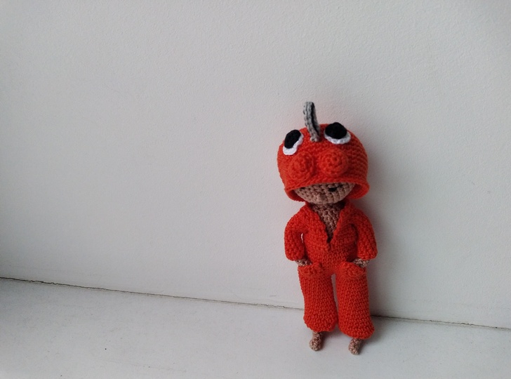 Doll with chainsaw and eyes on her hoodie, crochet amigurumi