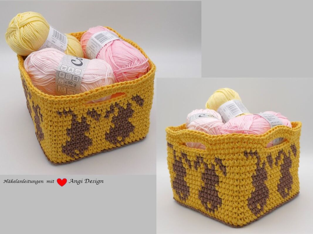 Gelbes, rechteckiges gehäkeltes Körbchen mit braunen Hasenmotiven, gefüllt mit rosa und gelben Garnknäueln