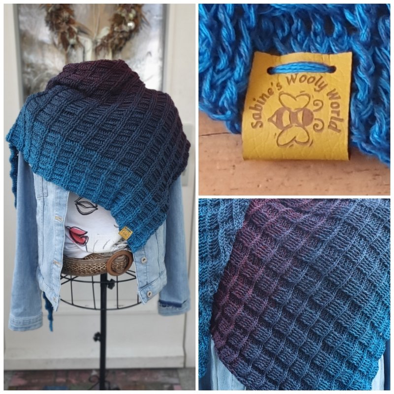 Triangle crochet shawl with waffle stitch texture in teal-to-plum gradient draped on a mannequin wearing a denim jacket