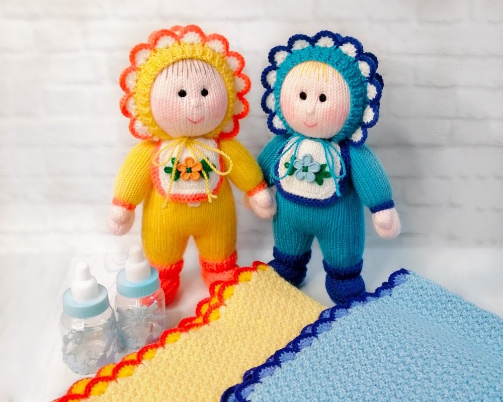 K101 Baby doll with blanket, bonnet, bib and a hat. Baby shower