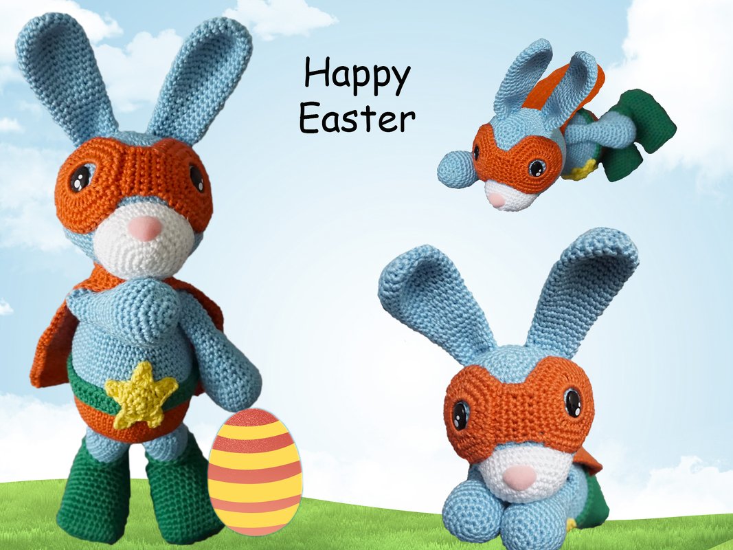 Light-blue crocheted amigurumi rabbit with orange mask and cape next to a striped Easter egg