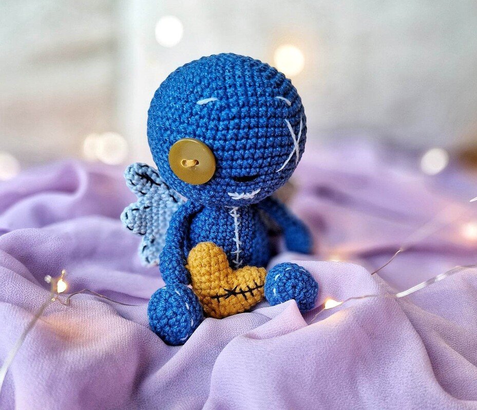 Crochet voodoo doll with wings and heart