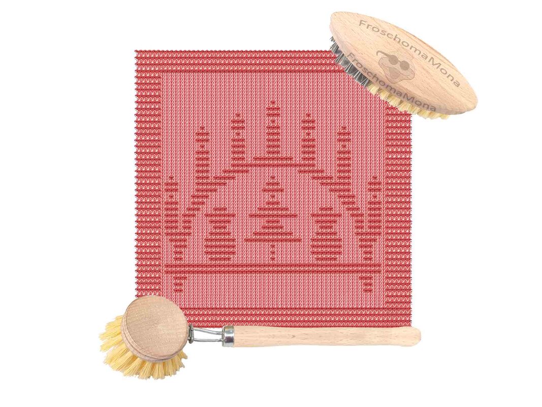 Rotes Strickdeckchen mit stilisiertem Kerzenmotiv