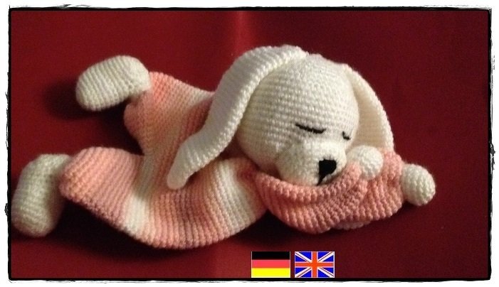 Pink striped crochet baby snuggle blanket with sleepy white head