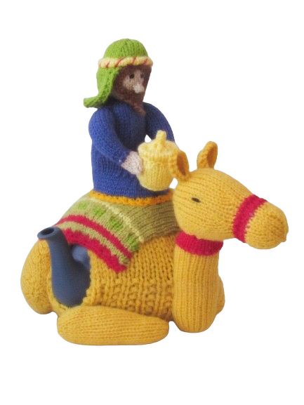 Yellow knitted camel tea cosy with a small rider and visible blue teapot spout and handle