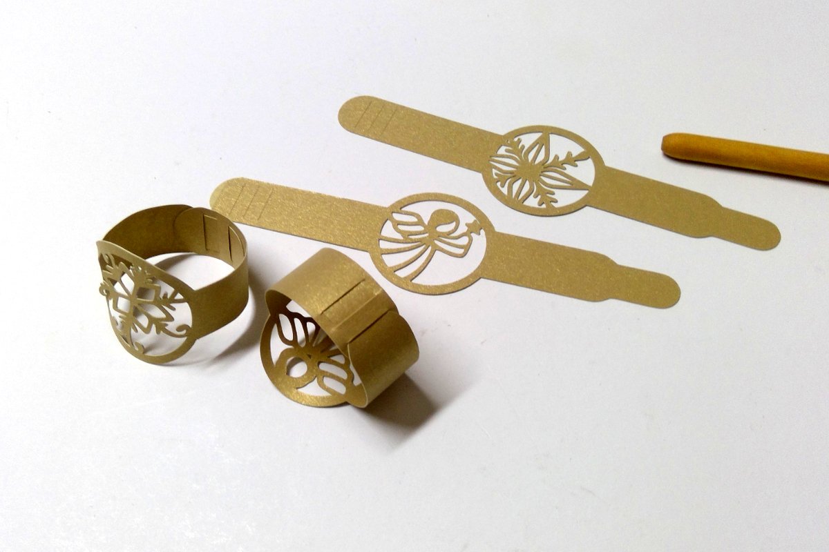 Goldene Plottdateien für Serviettenringe mit Engel- und Schneeflockenmotiven