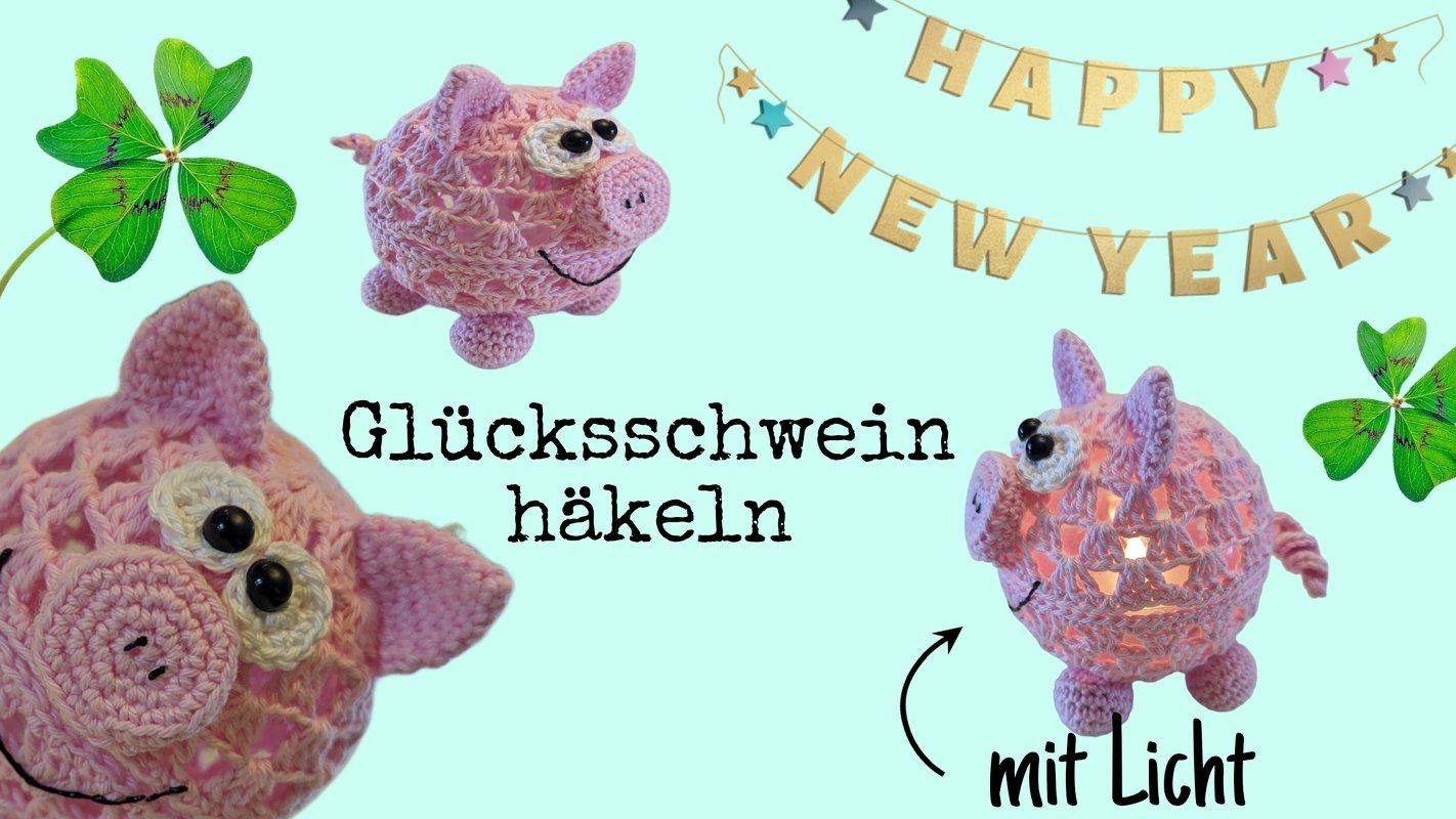 Rosa gehäkeltes Glücksschwein in Kugelform mit leuchtendem Innenraum, Nahaufnahmen und ‚Happy New Year‘-Girlande