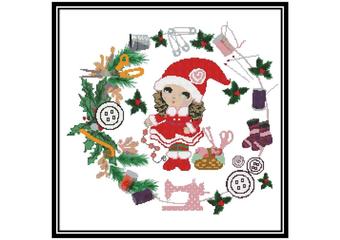 Cross stitch. Needlewoman girl Christmas wreath