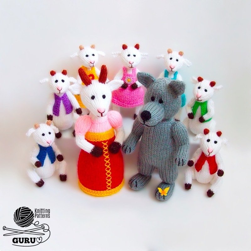 Studio reference photo of knitted amigurumi: adult goat, grey wolf, and several kid goats on a white background