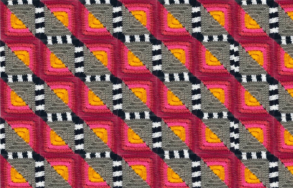 Häkeldecke aus bunten Granny Squares mit gelbem Zentrum, pinken Ringen, grauen Flächen und schwarz-weißen Streifen