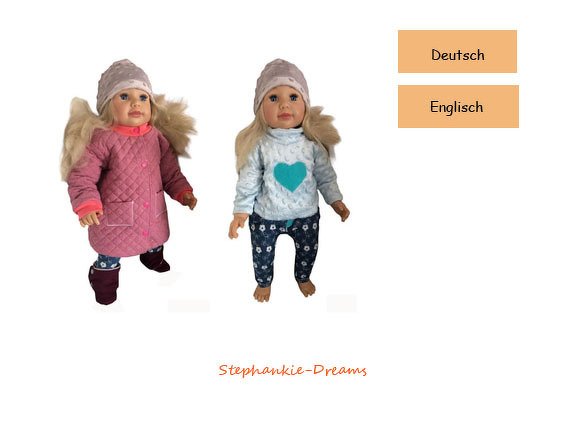 Two dolls in handmade clothes: one in a pink quilted coat and hat, the other in a light-blue sweater with a teal heart, floral pants, and a beanie.