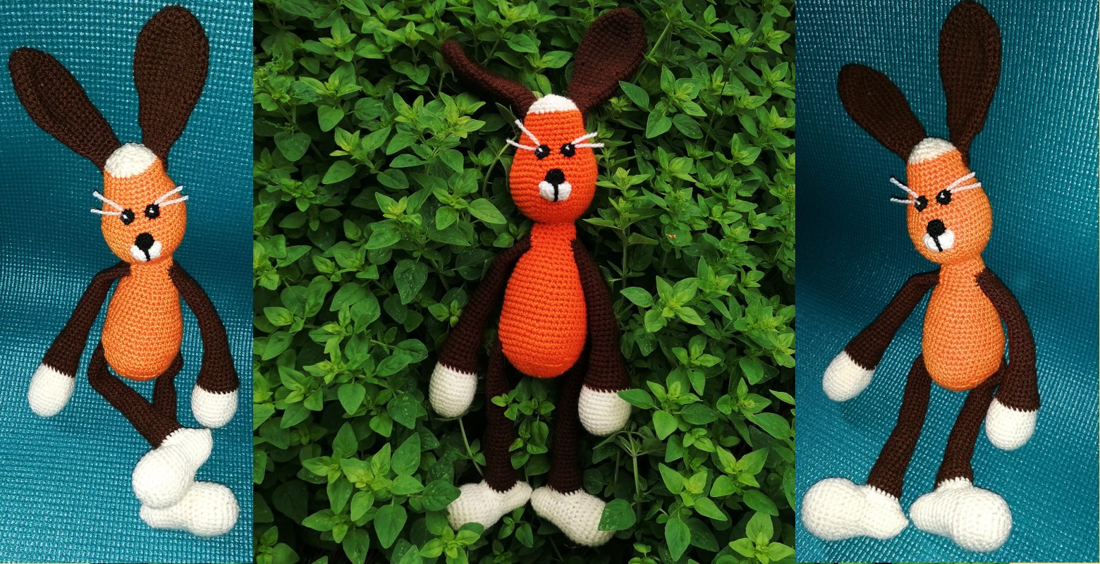 Gehäkelter Amigurumi-Hase in Orange und Braun mit weißen Pfoten und langen Ohren
