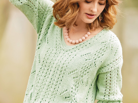 Lindgrüner V-Ausschnittpulli mit Ajourmustern