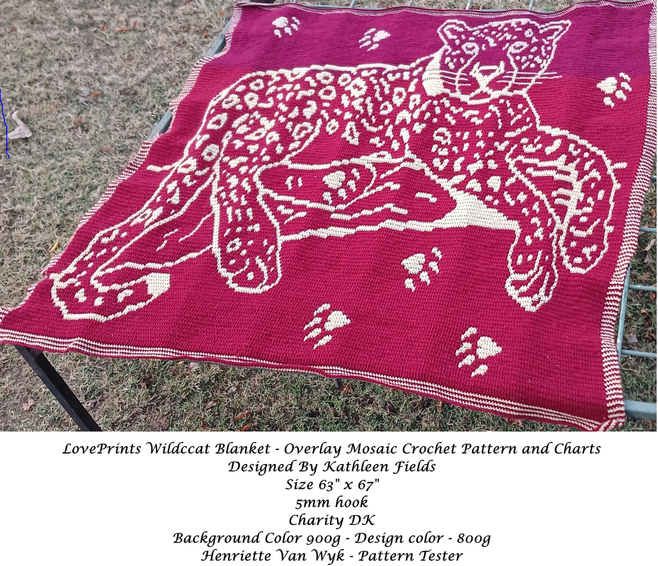 Maroon crochet blanket with a large cream leopard motif, paw prints, and a striped border.