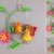 Flower fairy - hanging decoration made from scraps of yarn