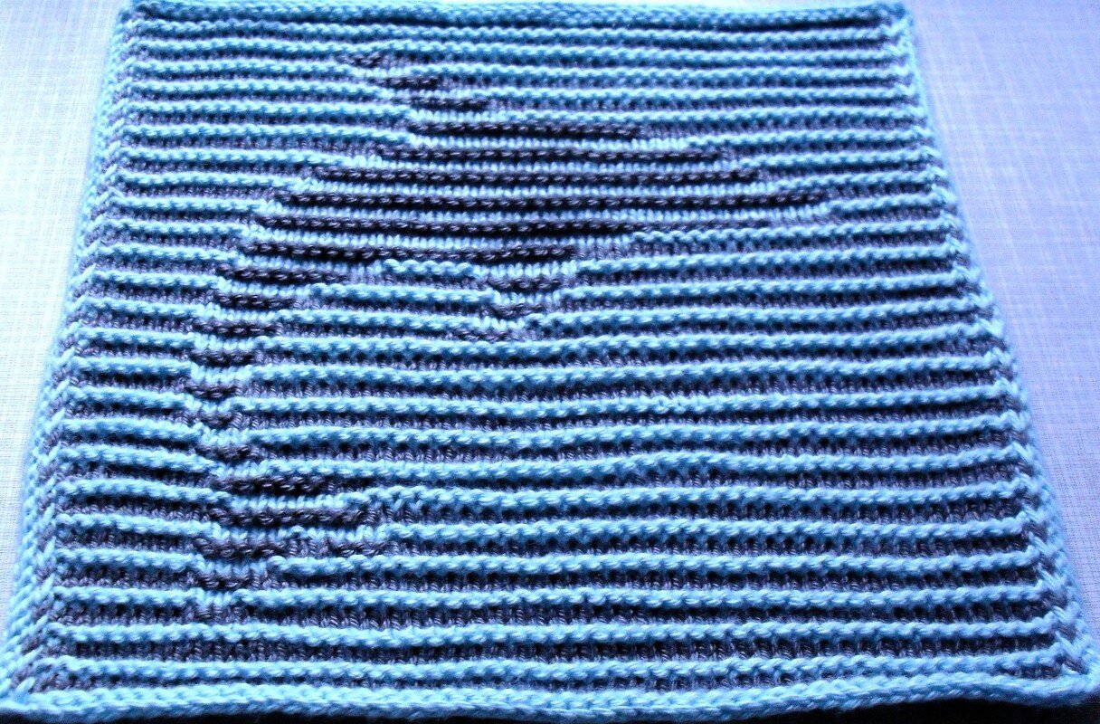 Delphin in Schattenstricktechnik mit dem besonderen Rand