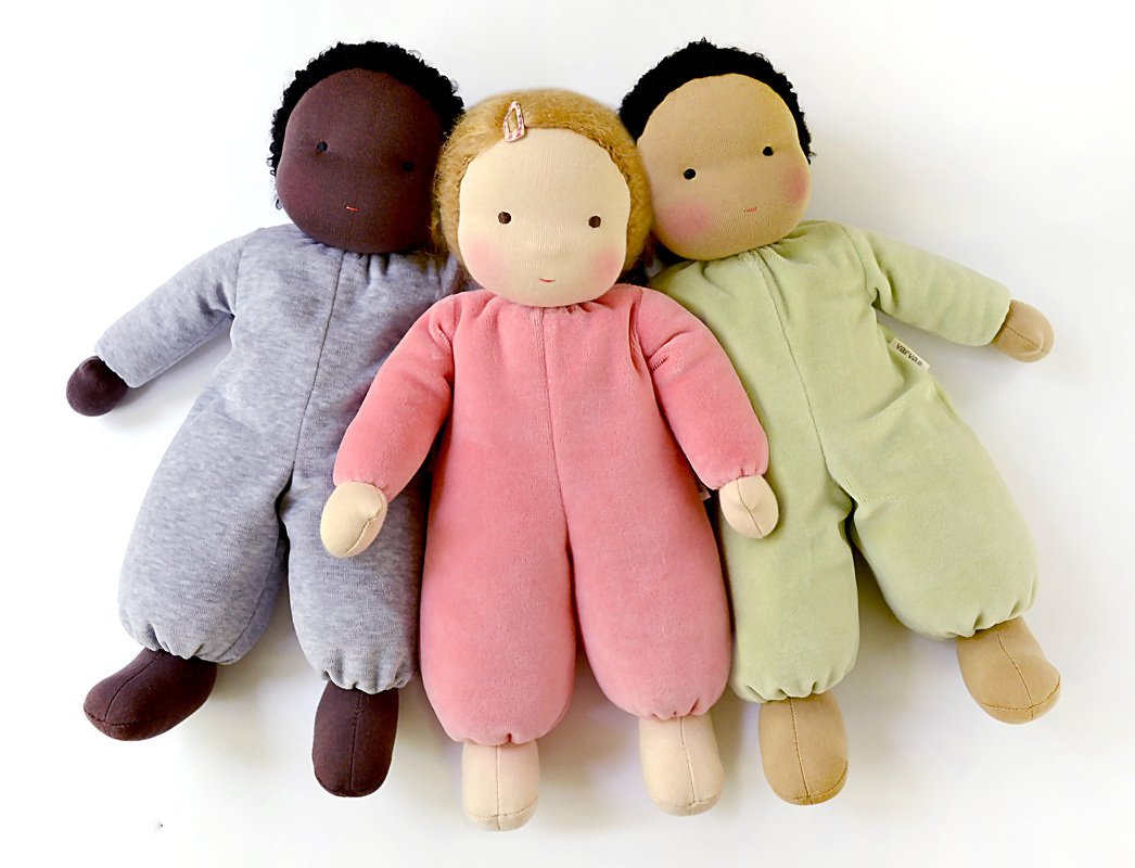 Three handsewn cloth dolls in gray, pink and light green playsuits
