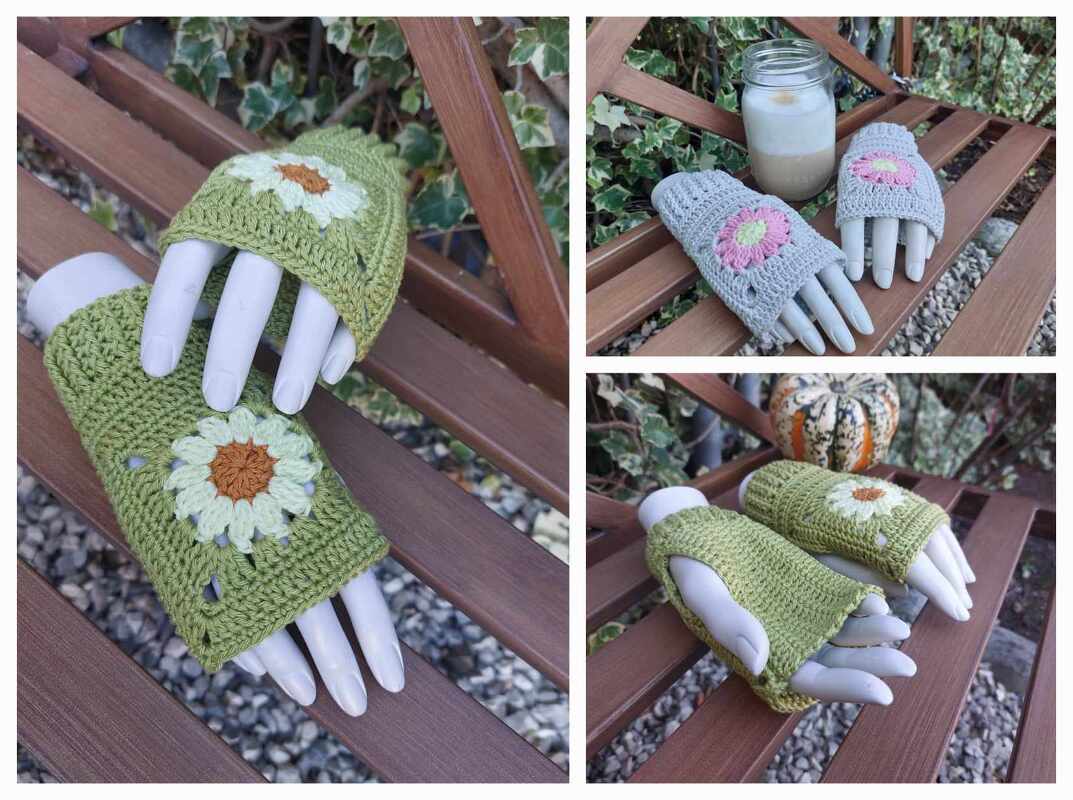 Zwei Paare gehäkelter, fingerloser Armstulpen mit Blumenapplikationen auf einer Holzbank, grün und grau