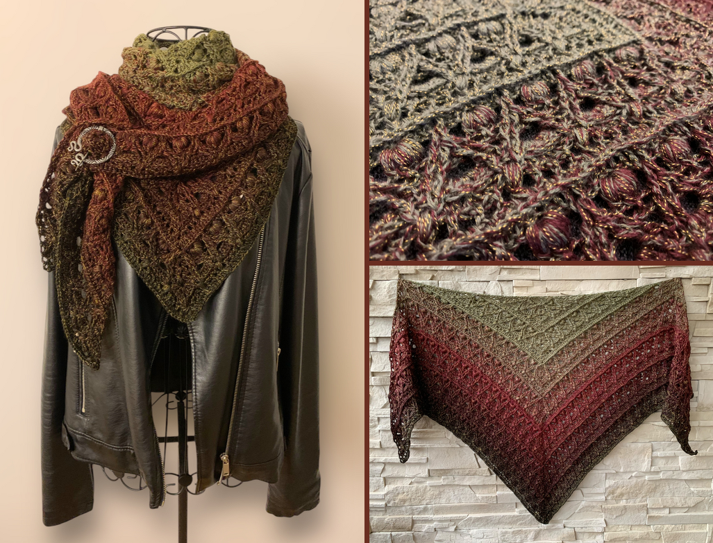 Olive to reddish-brown gradient triangle crochet shawl with subtle metallic sparkle, draped on a mannequin over a black jacket and pinned.