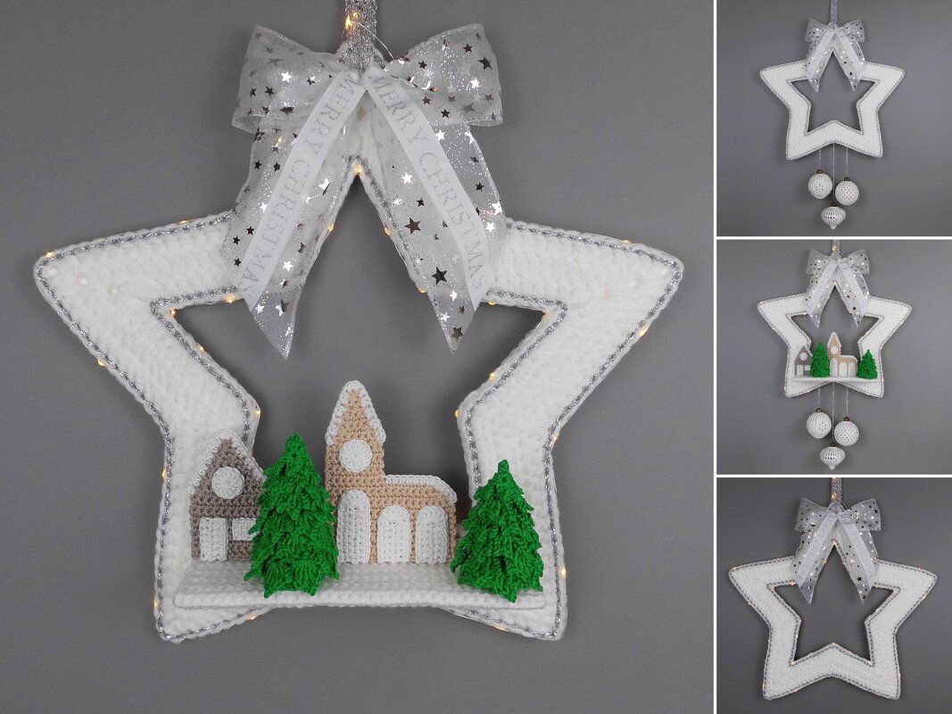 Weißer gehäkelter Stern mit silberner Kante, Lichterkette und Schleife mit dem Schriftzug „Merry Christmas“, im Inneren ein gehäkeltes Winterdorf mit Häusern, Kirche und Tannen.