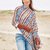 Lässiges Set aus Poncho und Armstulpen