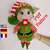 Lulu doll in a Christmas elf outfit, amigurumi christmas pattern.