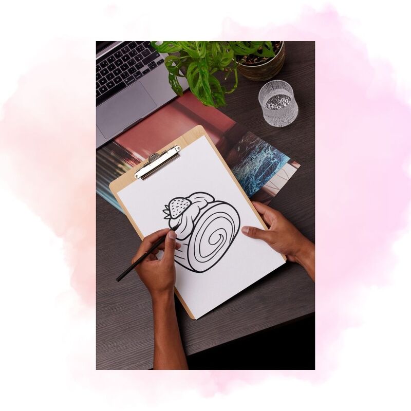 Ausmalvorlage einer gerollten Süßspeise mit Erdbeere auf Klemmbrett