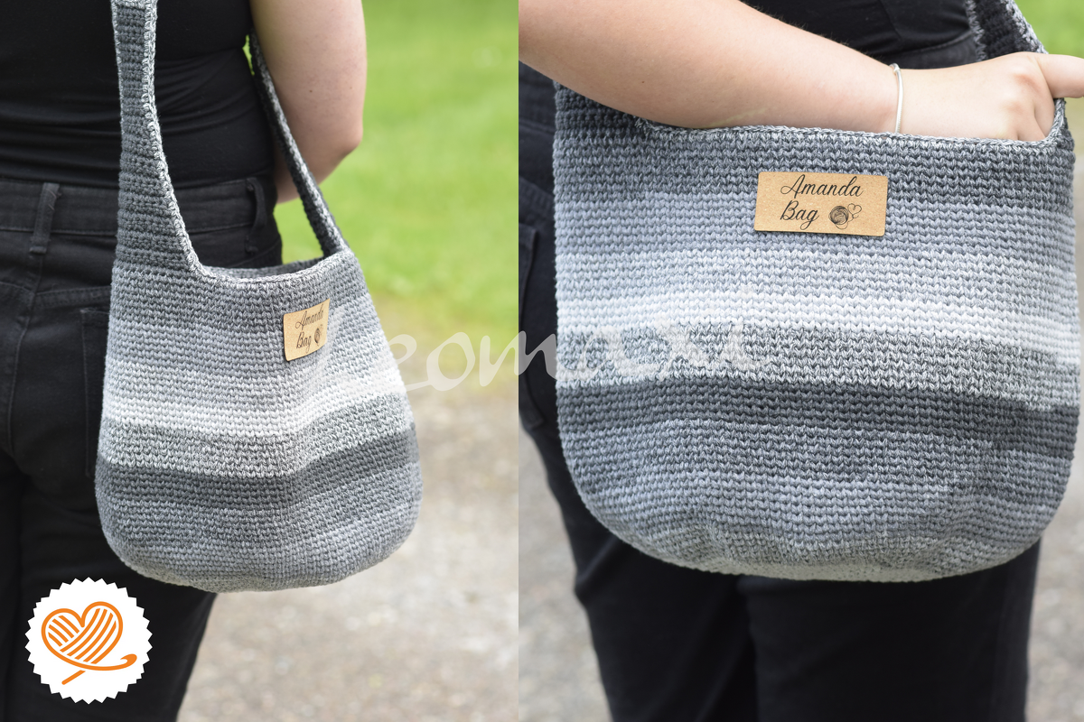 Grey ombre crochet shoulder bag with long strap and rounded base, worn over the shoulder against black clothing
