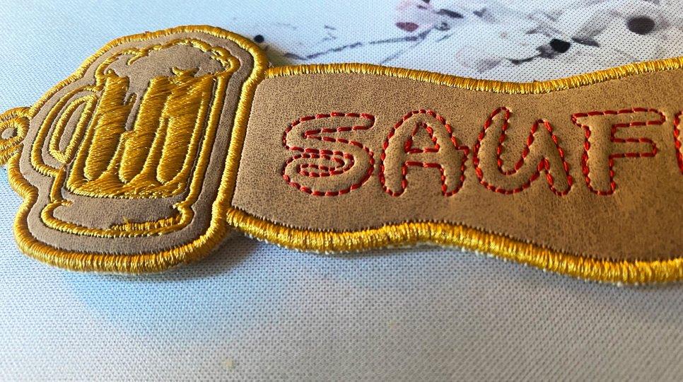 Stickdatei 3D-Anhänger SAUFMUDDI, Maschinenstickdatei