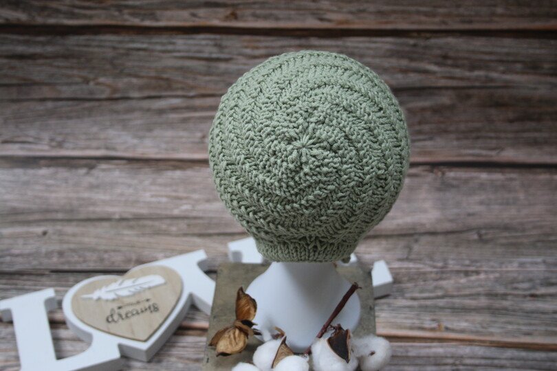 Whirlwind knitted bonnet in a spiral pattern