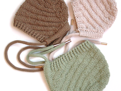 Whirlwind knitted bonnet in a spiral pattern