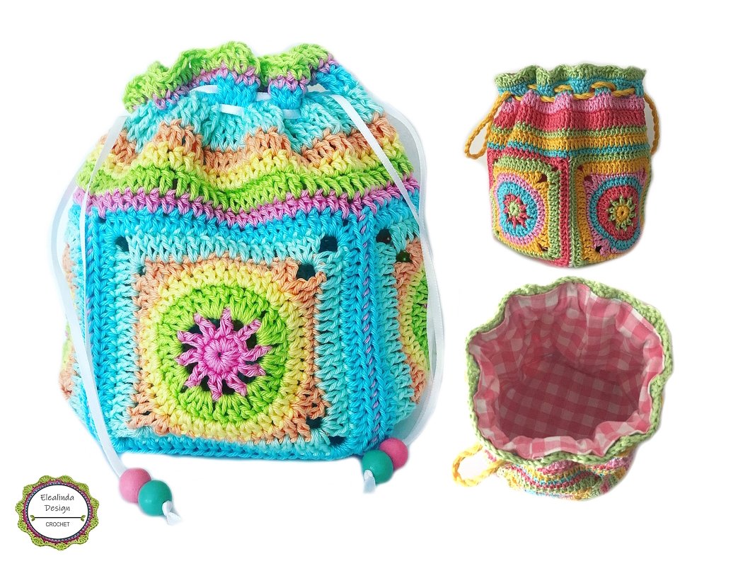 Pastel crocheted drawstring pouch with granny-square panels, ribbon drawstring with beads, and pink gingham lining.