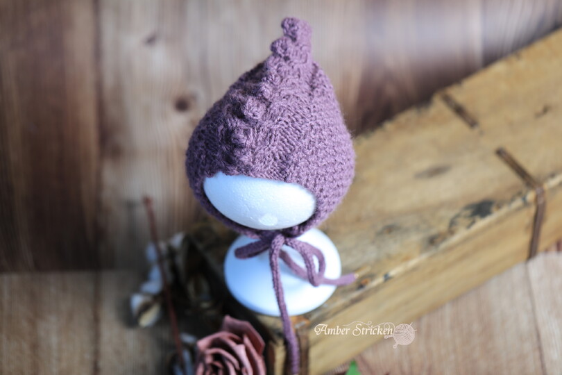 Dragon hat/bonnet knitted in a cable pattern with bobbles No. 008