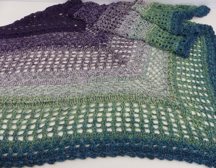 Crochet pattern for the happy time shawl, a light and airy triangular shawl