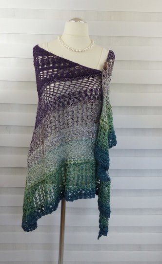 Crochet pattern for the happy time shawl, a light and airy triangular shawl