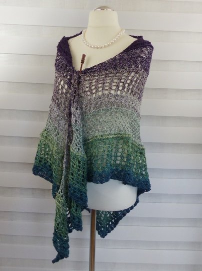 Crochet pattern for the happy time shawl, a light and airy triangular shawl
