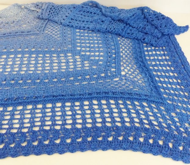 Crochet pattern for the happy time shawl, a light and airy triangular shawl
