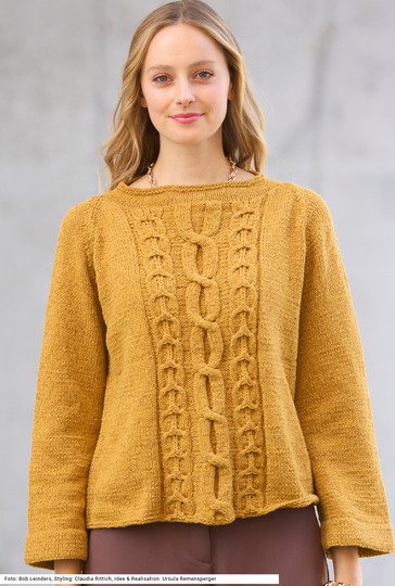 Raglanpullover mit Zopfmuster