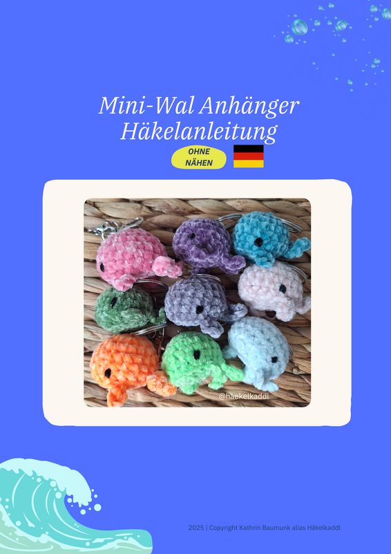 Neun bunte gehäkelte Mini-Wale mit Schlüsselringen auf geflochtener Unterlage