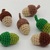 Small crocheted acorns